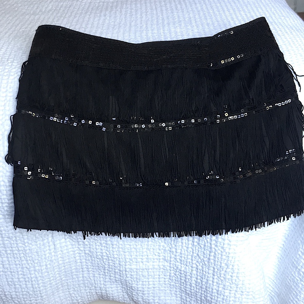 Black tassel and glittery skirt
